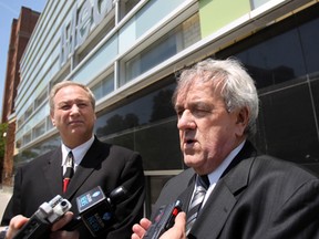 Downtown Windsor BIA chairman Larry Horwitz, left,  and St. Clair College president John Strasser outside the college's MediaPlex in downtown Windsor, Ont. on May 16, 2012. (Dax Melmer / The Windsor Star)