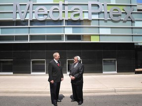 Downtown Windsor BIA chairman Larry Horwitz (L) and St. Clair College president John Strasser address media outside the college's MediaPlex in downtown Windsor, Ont. on May 16, 2012. (Dax Melmer / The Windsor Star)