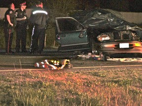 WINDSOR, ONT., May 5, 2012 -- A Ford Explorer is covered with a tarp as police investigate a fatal single-vehicle accident on E.C. Row just west of Banwell Road on Saturday, May 5, 2012. (REBECCA WRIGHT/ The Windsor Star)