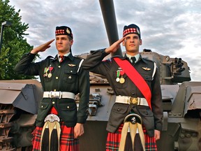 WINDSOR, ONT., May 26, 2012--Twin brothers chief warrant officer Peter (left) and warrant officer Sean Romanko give a salute during the 2715 Metropolitan Legion Army Cadet Corps 50th anniversary reunion held at the Maj. F. A. Tilston Armoury on Saturday, May 26, 2012. (REBECCA WRIGHT/ The Windsor Star)