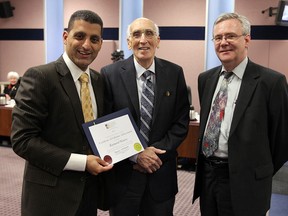 Raymond Masters, local architect and landscape architect, is honoured with the a lifetime achievement certificate by Mayor Eddie Francis (centre and Robin Easterbrook, chair of the Windsor Heritage Commitee, at city hall in Windsor on Tuesday, May 22, 2012.          (TYLER BROWNBRIDGE / The Windsor Star)