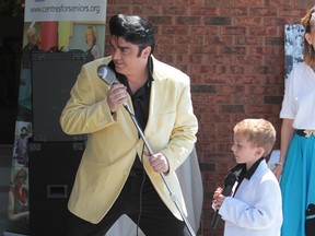 Elvis tribute artist Norm Ackland Jr. and his 5-year-old protege (and son) Jax perform at a preview of Windsor Elvis Fest 2012 at the Roseland Golf and Curling Club in Windsor, Ont. on May 17, 2012. The festival takes place at the club June 22 to 24. (Jason Kryk / The Windsor Star)