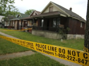 Police tape surrounds a vacant house at 3321 Edison St. in the west end of Windsor, Ont. The house caught fire early May 26, 2012. Investigators believe the blaze was caused by arson - one of four deliberately set fires over the weekend. (Dax Melmer / The Windsor Star)