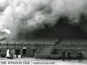 Windsor,ONT. July 13 1957-Firemen race for the exit when it is apparent the blaze at the Jackson Park grandstand was getting out of hand. (The Windsor Star- Bud Revell)