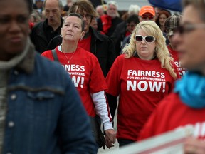 WINDSOR, ONT.:MAY 5, 2012 -- Zellers employeed, Ruth Logan, left, and Patti Pattenden, attend a rally outside the Devonshire Mall Zellers Saturday, May 5, 2012, to protest Target's labour policies.  (DAX MELMER/The Windsor Star)