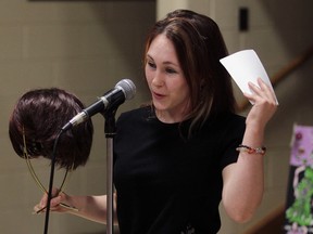 Survivor Sandra Cronin donates her hair piece at William Davis Public School where students, family and staff participated in a hair-cutting event to provide funds for Make-A-Wish Foundation June 21, 2012. (NICK BRANCACCIO/The Windsor Star)