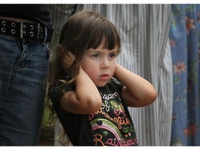 Emma Beven, 3, covers her ears from the loud gun shot while at the Noon Gun firing at King's Naval Yard Park in Amherstburg, Saturday, June 16, 2012. (Dax Melmer/The Windsor Star)