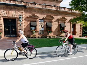 Cyclists pass by Hiram Walker in this file photo. (Nick Brancaccio/The Windsor Star)