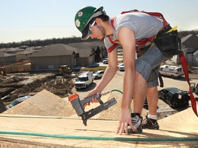 In this file photo, Matt Vachon works on a roof of a home under construction in the 1900 block of McKay Ave in the Siesta South subdivison. (Dan Janisse/The Windsor Star)