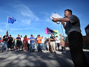 Dino Chiodo, president of Local 444 Canadian Auto Workers, speaks at a rally protesting the Conservative budget bill outside of local MP Jeff Watson's office June 13, 2012 in Essex, Ont. (KRISTIE PEARCE/THE WINDSOR STAR)