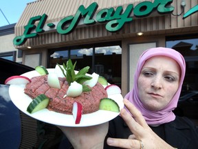 Lina Abbas of El-Mayor Restaurant on Wyandotte Street East, displays a plate of kibbeh which they cannot serve Monday June 25, 2012. (NICK BRANCACCIO/The Windsor Star)