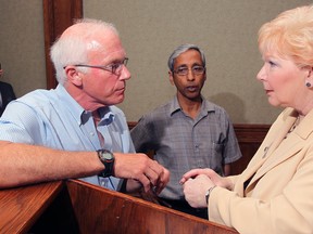 Patricia Nelson, right, vice chair of In Situ Oil Sands Alliance speaks with Keith Taylor, left, and Nihar Biswas of the University of Windsor during an informational exchange session organized by the Windsor-Essex Regional Chamber of Commerce and held at Giovanni Caboto Club of Windsor, Monday June 25, 2012. (NICK BRANCACCIO/The Windsor Star)