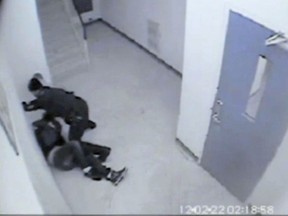 An image from a surveillance camera video that allegedly shows Const. Kent Rice of Windsor police assaulting Gladson Chinyangwa on Feb. 22, 2012. (The Windsor Star)