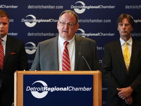 Bill Stoves, Ford North America manager of supply chain management, center, speaks at the Detroit Regional Chambers with Brad Williams, Detroit Regional Chambers vice president of governmnet affairs, left, and Kim Hill, Center for Automotive Research director of sustainability and economic development strategies and associate research director, right, in downtown Detroit, Michigan, Thursday, June 14, 2012.   (DAX MELMER/The Windsor Star)