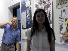 A screen shot of a video by Assumption College Catholic High School featuring teachers dancing behind oblivious students.