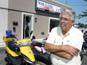 Brian Tucker, owner of Scoot-A-Long of Windsor Electric Bikes, is pictured in front of his store, Saturday, June 30, 2012.  Tucker is against the proposed ban of electric bikes on paths and sidewalks.  (DAX MELMER/The Windsor Star)