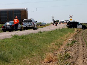 WINDSOR, ONT., June 10, 2012 -- OPP investigate a fatal accident between a minivan and a CP freight train on Strong Road near Country Rd. 42 in Lakeshore on Sunday morning. The accident claimed the lives of two young girls under the age of six. A man, an infant and a young boy under the age of six were also in the van at the time and were taken to a Windsor hospital to be treated for their injuries. (REBECCA WRIGHT/ The Windsor Star)