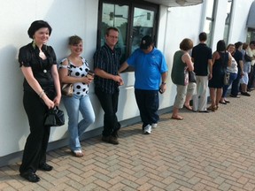 A crowd lines up for for free earrings outside Joseph Anthony Fine Jewelry in Windsor. (Nick Brancaccio/The Windsor Star)