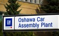 The sign at the General Motors assembly plant in Oshawa, Ont. is seen in this August 2011 file photo. (Brent Lewin / Bloomberg)