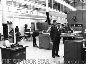 March 10/ 1967-The carpentry shop at William Hands Vocational School features a complete range of wood working equipment, including a band saw, planners and smaller machines. Gordon Aitchison, left principal, watches Jim McLeod a student. (The Windsor Star-FILE)