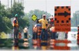 Paving workers seen through heat waves in July 2010. (Windsor Star file photo)