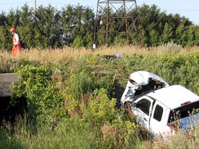 An employee with CN Rail walks along the tracks following a collision between a freight train and Silverado pick-up truck Wednesday, June 27, 2012. (DYLAN KRISTY/The Windsor Star)