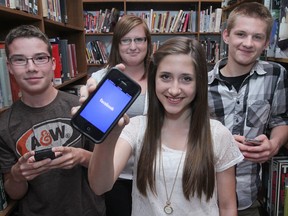 Walkerville Collegiate Institute students pose in the high school's library on June 13, 2012. From left: Alec Caille, 16; Audra June, 16; Emily Conlon, 15; Andrew Wiebe, 16. (Dax Melmer / The Windsor Star)