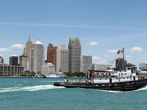 A flotilla of tug boats makes its way up the Detroit RIver in Windsor on Saturday, June 23, 2012. The tug boat Manitou won the annual race. (The Windsor Star / TYLER BROWNBRIDGE)