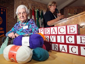 Ruth Byrnes, 100, is honoured by Windsor-Roseland Rotary Club following her continued service to the "Knit for Newborns" project during a ceremony at Fogolar Furlan Club Tuesday July 24, 2012. Behind, Windsor-Roseland Rotary president Joyce Jones announces the names of other recipients. (NICK BRANCACCIO/The Windsor Star)