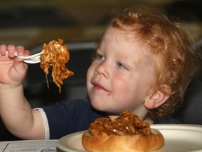 The annual Poor Boy Luncheon was held Friday, June 1, 2012, at the downtown Armouries. A steady crowd took in the event. William McAree, 22 months, was digging into the featured pulled chicken sandwich. (DAN JANISSE/ The Windsor Star)