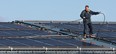 A worker installs rooftop solar panels in this file photo. (Dan Janisse/The Windsor Star)