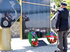 In this file photo, Windsor councillor Ron Jones salutes the Canadian Vietnam Veterans Memorial in Windsor.