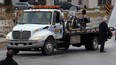 In this file photo, Paul Rocheleau's motorcycle was carried on the back of a flatbed tow truck in a procession of tow trucks at St. Joseph Catholic Church in River Canard for Rocheleau's funeral Monday Jan. 23, 2012. (NICK BRANCACCIO/The Windsor Star)