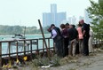 Detroit homicide investigators, patrol officers and dive team members investigate the crime scene following the discovery of body parts from at least two people in the Detroit river in Detroit on July 17, 2012. (JASON KRYK/ The Windsor Star)