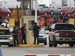 Border guards inspect vehicles Thursday coming into the United States Thursday from the Ambassador Bridge in this file photo. (Dan Janisse/THE WINDSOR STAR)