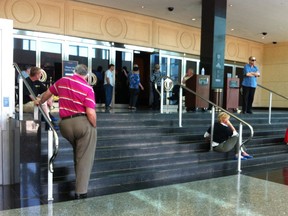 Patrons wait outside of Caesars Windsor after the casino was evacuated due to a security camera failure.