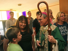 Bishop Ronald Peter Fabbro meets with members of the congregation before the last service at Blessed Sacrament church, Sunday, July 1, 2012.  (DAX MELMER/The Windsor Star)