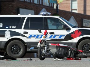 WINDSOR, ONT.:JULY 8, 2012 -- An E-Bike rests on the ground in front of a Windsor Police cruiser after being struck by an SUV at the intersection of Parent Avenue and Ottawa Street, Sunday, July 8, 2012. (DAX MELMER/The Windsor Star).