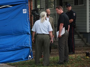 Windsor police and a coroner are at the scene of a fatal house fire at 828 Louis Avenue that is being treated as suspicious, Saturday, July 28,  2012.  (DAX MELMER/The Windsor Star)
