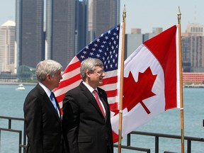 MIch. Gov. Rick Snyder and Prime Minister Stephen Harper stroll Windsor's waterfront June 15.