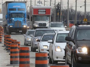 Traffic backed up along Huron Church Road near the Grand Marais Drain due to construction of the Windsor-Essex Parkway in March 2012. (DAN JANISSE/The Windsor Star)