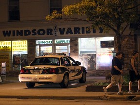 Windsor police investigate a robbery at Windsor Variety On Ouellette Avenue and Elliott Street shortly after 10 p.m. Friday July 6, 2012 in Windsor, Ont. (Kristie Pearce/WINDSOR STAR)