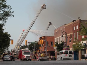 Firefighters battle a large fire at The Sunset Club in downtown Leamington, Ont. on July 18, 2012. (JASON KRYK/ The Windsor Star)