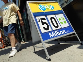 A sign advertises the $50-million Lotto MAX jackpot at Ray & Kim's Super Convenience in downtown Windsor this past summer. The jackpot has again reached $50 million, with no winner Friday, Oct. 25, 2013. (Tyler Brownbridge / The Windsor Star)