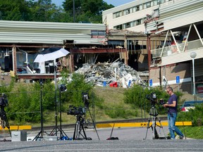 Media equipment lines the entrance to the Algo Centre Mall in Elliot Lake, Ont., on June 28, 2012. Ontario's government says it will spend $2 million to help Elliot Lake businesses recover after a deadly mall collapse. THE CANADIAN PRESS/Nathan Denette