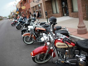 Motorcycles are parked along the curb on Erie Street as hundreds of motorcyclists descended onto LIttle Italy for a bike rally, Thursday, July 26, 2012. The rally is part of Bikefest, which is conjunction with the 24th Ontario Provincial H.O.G. Rally.