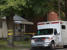 Investigators continue to inspect the scene of a homicide at 828 Louis Ave. in Windsor, Ont., Sunday, July 29, 2012. (DAX MELMER/The Windsor Star)