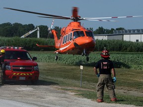 An Ornge helicopter transports a patient to hospital from the Highline Mushroom Plant in Kingsville on Monday, July 30, 2012. A person suffered sever injuries at the site and was airlifted to hospital. (The Windsor Star / TYLER BROWNBRIDGE)