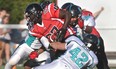 Mississauga's Stanislaus Elad, centre, is tackled by Essex's Matt Lefter, bottom, and Frank Renaud during OVFL playoff action in Essex Saturday, July 28, 2012. The Ravens won 39-9. (REBECCA WRIGHT/ The Windsor Star)