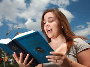 Drama student, Brooke Trealout, 17, recites works from Shakespeare on the corner of Ouellette Avenue and University Avenue, Saturday, July 28, 2012. (DAX MELMER/The Windsor Star)